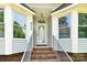 Inviting front entrance with decorative glass door and bay windows at 511 Brookwood Dr, Statesville, NC 28677