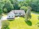 Beautiful home with a well-manicured lawn, inviting front entrance, and mature shade tree at 511 Brookwood Dr, Statesville, NC 28677