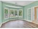 Light-filled room with hardwood floors, bay windows and open doorway at 511 Brookwood Dr, Statesville, NC 28677