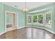 Spacious living room with large bay windows and wood floors at 511 Brookwood Dr, Statesville, NC 28677