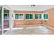 Cozy sunroom featuring tile floor and three large windows to bring in nature light at 511 Brookwood Dr, Statesville, NC 28677