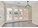 View of the sunroom with tile floor and exterior access door and windows at 511 Brookwood Dr, Statesville, NC 28677