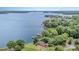 Expansive aerial view showcases the lakefront property with mature trees at 5114 Leisure Ln, Sherrills Ford, NC 28673