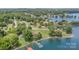 Expansive aerial view of lakefront homes with docks, lush trees, and clear blue water at 5114 Leisure Ln, Sherrills Ford, NC 28673