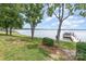 Lush backyard featuring mature trees and a private dock on the tranquil lake at 5114 Leisure Ln, Sherrills Ford, NC 28673