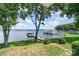 Stunning lake view from backyard featuring mature trees and a private dock at 5114 Leisure Ln, Sherrills Ford, NC 28673
