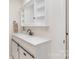 Modern bathroom with a white vanity, sleek fixtures, and stylish sliding-door storage at 5114 Leisure Ln, Sherrills Ford, NC 28673