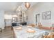 Open concept dining room leading to kitchen with pendant lighting and light gray flooring at 5114 Leisure Ln, Sherrills Ford, NC 28673
