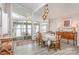 Dining room features oversized windows overlooking the lake, light gray flooring and decorative chandelier at 5114 Leisure Ln, Sherrills Ford, NC 28673