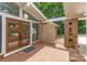 Home features brick pavers, double doors with geometric details, and decorative breeze blocks at 5114 Leisure Ln, Sherrills Ford, NC 28673