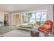 Living room with large windows offering waterfront views, stylish seating and light gray floors at 5114 Leisure Ln, Sherrills Ford, NC 28673