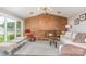 Living room boasts a brick fireplace, waterfront views, and stylish decor at 5114 Leisure Ln, Sherrills Ford, NC 28673