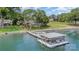 Scenic waterfront property featuring a boat dock and meticulously landscaped grounds at 5114 Leisure Ln, Sherrills Ford, NC 28673