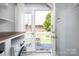 Balcony overlooking fenced yard with white curtains at 524 Hawthorne Ln, Charlotte, NC 28204