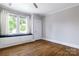 Bedroom featuring a window seat and hardwood floors, offering a bright and comfortable space at 524 Hawthorne Ln, Charlotte, NC 28204