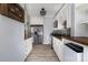 Bright kitchen with granite counters, stainless appliances, washer/dryer and hardwood style floors at 524 Hawthorne Ln, Charlotte, NC 28204