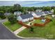 Aerial view of a cozy home with a fenced backyard, wooden deck, and storage shed at 532 Jedburgh Way, Rock Hill, SC 29730
