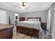 Spacious main bedroom featuring a tray ceiling, stylish furniture, and neutral color palette at 532 Jedburgh Way, Rock Hill, SC 29730