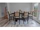 Elegant dining room with seating for six, stylish rug, and natural light at 532 Jedburgh Way, Rock Hill, SC 29730