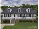 Charming home with a welcoming front porch, dormer windows, and manicured lawn at 532 Jedburgh Way, Rock Hill, SC 29730