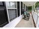 Front porch with rocking chairs featuring floral cushions and a view of the lawn at 532 Jedburgh Way, Rock Hill, SC 29730