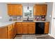 Bright kitchen with wood cabinets, stainless steel appliances, and durable countertops at 532 Jedburgh Way, Rock Hill, SC 29730