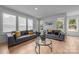 Cozy living room with neutral tones, hardwood floors, and ample natural light at 6032 Corbin Woods Ct, Charlotte, NC 28226
