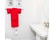 Neat powder room features a modern sink and bright red towels hanging on the wall at 628 Uwharrie River Rd, Charlotte, NC 28211