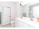 Spacious bathroom featuring a double sink vanity, white cabinetry, and a glass-enclosed shower at 628 Uwharrie River Rd, Charlotte, NC 28211