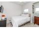 Cozy bedroom with a full-sized bed, neutral bedding, and natural light from the window at 628 Uwharrie River Rd, Charlotte, NC 28211