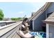 Inviting deck featuring a hanging chair, wicker rocking chairs, and beautiful views at 628 Uwharrie River Rd, Charlotte, NC 28211