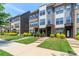 Attractive townhome exteriors with brick and siding, complemented by vibrant landscaping and well-maintained lawns at 628 Uwharrie River Rd, Charlotte, NC 28211