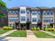 Desirable townhome featuring brick accents, contemporary siding, well-maintained lawns, and mature landscaping at 628 Uwharrie River Rd, Charlotte, NC 28211