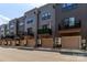 Row of townhomes, each with balcony, garage, and mini-split air conditioners at 628 Uwharrie River Rd, Charlotte, NC 28211