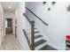 Upstairs hallway and staircase with dark wood accents and decorative wall hangings at 628 Uwharrie River Rd, Charlotte, NC 28211