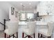 Open kitchen featuring a breakfast bar, white cabinets, and a view into the living space at 628 Uwharrie River Rd, Charlotte, NC 28211