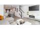 Contemporary living room with TV, fireplace, and staircase leading to the second floor at 628 Uwharrie River Rd, Charlotte, NC 28211