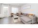 Bright living room featuring a comfortable gray sectional sofa and modern decor at 628 Uwharrie River Rd, Charlotte, NC 28211