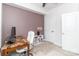 Cozy home office with a desk, comfortable chair, a bookshelf with decor, and neutral carpet at 628 Uwharrie River Rd, Charlotte, NC 28211