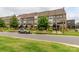 Street view showcases modern townhomes with manicured lawns and mature trees at 628 Uwharrie River Rd, Charlotte, NC 28211