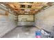 Unfinished basement area with exposed ceiling beams and concrete flooring, offering potential for customization at 639 S Eastway Dr, Troutman, NC 28166