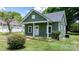Quaint home featuring a cozy front porch and freshly painted siding at 639 S Eastway Dr, Troutman, NC 28166