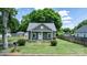 Charming green cottage with a well-maintained lawn and inviting front porch at 639 S Eastway Dr, Troutman, NC 28166