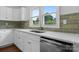 The bright kitchen includes stainless appliances, quartz countertops, and a stainless sink at 639 S Eastway Dr, Troutman, NC 28166