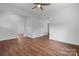 Bright living room with wood floors and neutral paint offers a ceiling fan at 639 S Eastway Dr, Troutman, NC 28166