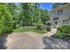Beautiful backyard with a white picket fence, lush landscaping, and access to the home at 6409 Ilex Ct, Charlotte, NC 28211