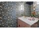 Stylish powder room with floral wallpaper and modern fixtures at 6409 Ilex Ct, Charlotte, NC 28211