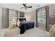 Comfortable bedroom featuring neutral colors, soft lighting, and ample natural light at 6409 Ilex Ct, Charlotte, NC 28211