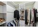 Walk-in closet with custom shelving, hanging rods, and ample storage for clothing and accessories at 6409 Ilex Ct, Charlotte, NC 28211