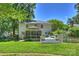 Back exterior showcasing a screened-in porch and tiered deck, perfect for outdoor living at 6409 Ilex Ct, Charlotte, NC 28211